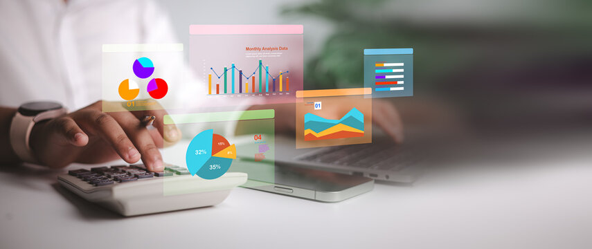 Businesswoman hands using calculator and laptop with holographic financial charts. Concept of data analysis, accounting, future fintech, audit and marketing technology on desk. - Powered by Adobe