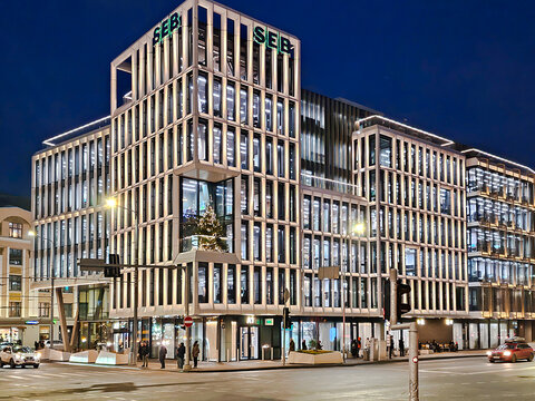 LATVIA, RIGA, 29, DECEMBER, 2025: The modern multi-story SEB bank building illuminated at night and decorated for New Year's Eve in the center of Riga, Latvia