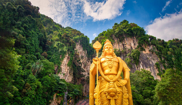 Statue of Lord Muragan and entrance with blue sky in Batu Caves, Kuala Lumpur, Malaysia.