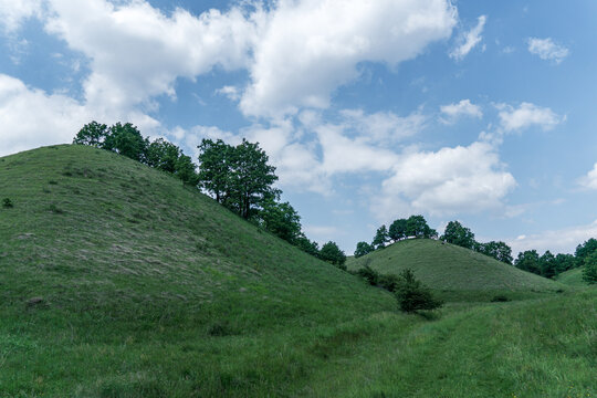 Beautiful green hills, pastures and trees of Zagajicka brda in Serbia near Vrsac. Scenic spring and summer nature landscape.