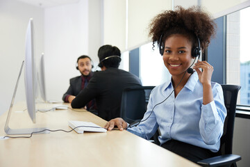 operator or businesswoman wearing headphones and smiling at call center service in the office