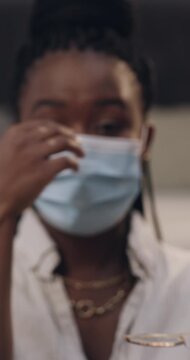Black woman, protection and online tutorial with face mask for health and safety tips in home. Portrait, female person or vlogger with protective wear in POV for helpful advice or compliance in house