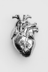 A crystal human heart made of chrome metal
