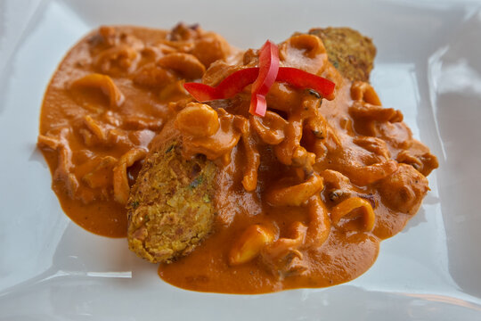 classic Tacu Tacu con Mariscos (Tacu Tacu with Seafood), a hearty and traditional dish that exemplifies the Afro-Peruvian culinary heritage of the coast, specifically in the style of Barranca.