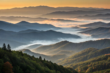 Fototapeta premium Layered mountain peaks shrouded in morning fog with golden sunrise sky full hd 4k stock image download