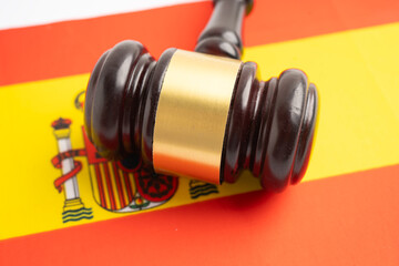 Spain Legal, justice and agreement, wooden court gavel on flag.