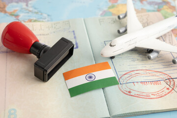 India flag with passport and airplane for travel.