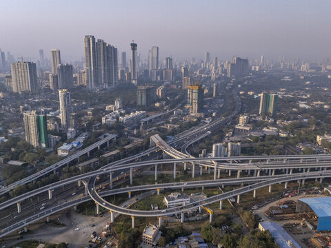 Aerial view of the Shri Atal Bihari Vajpayee Trans Harbour Link and towering skyscrapers piercing the skyline, Mumbai, Maharashtra, India.