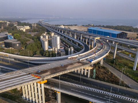 Aerial view of the majestic Shri Atal Bihari Vajpayee Trans Harbour Link gracefully curving over the landscape, Mumbai, Maharashtra, India.