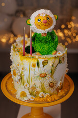 Decorated cake with animal figurine and floral details