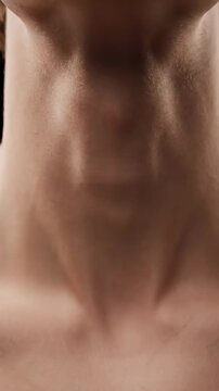 Extreme Close-Up of Male Neck Swallowing