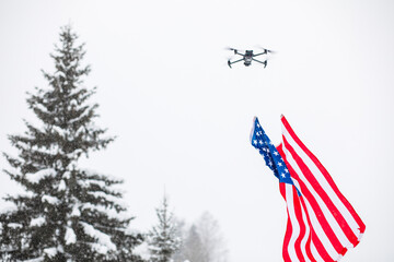 USA flag close up. Military drone with an American flag in the air over Greenland.