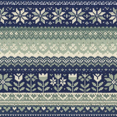 Seamless Nordic knitted pattern with snowflakes and flowers. Traditional Scandinavian Fair Isle sweater texture in blue and green for winter holiday backgrounds.