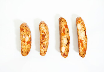 Italian cantucci cookies with nuts and candied fruits on a white background