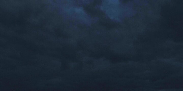 Dramatic 4K timelapse captures dark clouds overtaking the sky, highlighting intense weather changes, ominous atmosphere, and powerful storm dynamics