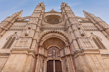 The west facade of Palma Cathedral, also known as La Seu, with its main portal and rose window, in Palma, Mallorca, Balearic Islands, Spain, Europe