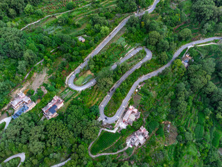 aerial view of Tibetan style houses on the green mountain at Danba in west Sichuan