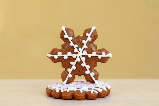 Decorated gingerbread cookies - snowflake on cookie with a scalloped edge - Powered by Adobe