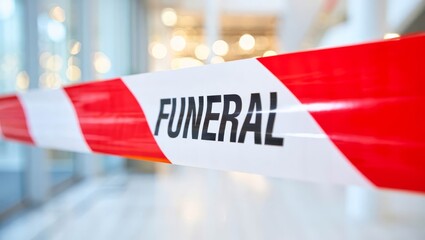 Text FUNERAL on red ribbon with white elements.