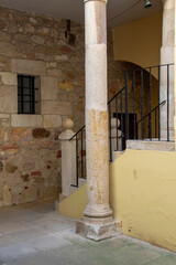 Mediterranean architectural detail with stone column and staircase