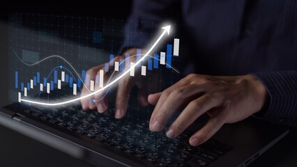 Businessman uses laptop for data analysis with modern graphics depicting trends and insights, emphasizing growth and financial strategies in a digital workspace. Copula