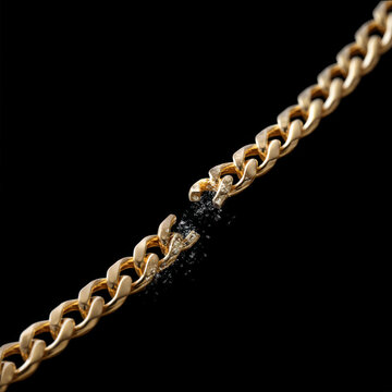 Side view of gold chain broken, sparkling detail, elegant jewelry, black background, close up, luxury accessory