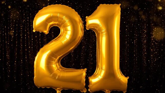 Golden 21 Balloon Anniversary - This video showcases two large golden foil balloons shaped as the number 21 against a dark backdrop with glittering bokeh lights.