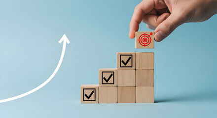 A hand placing a coin on a stack of boxes with checkmarks and an upward arrow symbolizing growth and progress