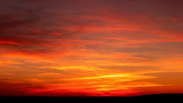 Colorful Sunset Sky with Clouds - The video depicts a beautiful sunset sky filled with various clouds.