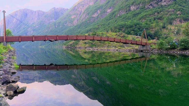 Wooden bridge over Naeroydalselvi river in Gudvangen Vestland Norway