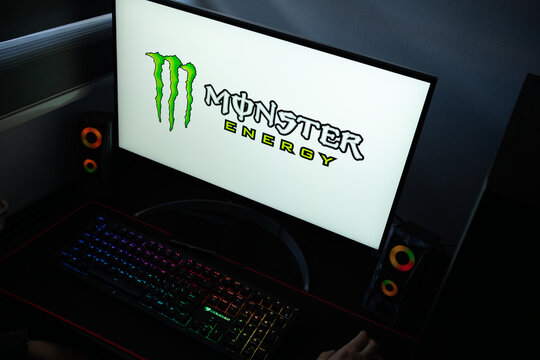 Punta Arenas, Chile &ndash; January 20, 2026: Iconic neon green "M-Claw" logo of Monster Energy displayed on a professional computer monitor