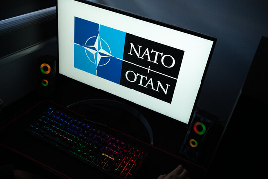 Punta Arenas, Chile &ndash; January 20, 2026: Iconic four-pointed compass rose logo of the North Atlantic Treaty Organization (NATO) displayed on a professional computer monitor