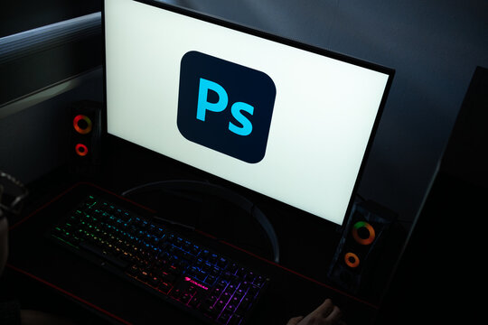 Punta Arenas, Chile &ndash; January 20, 2026: A desktop monitor featuring the stylized Adobe Photoshop logo alongside glowing computer peripherals and RGB lighting