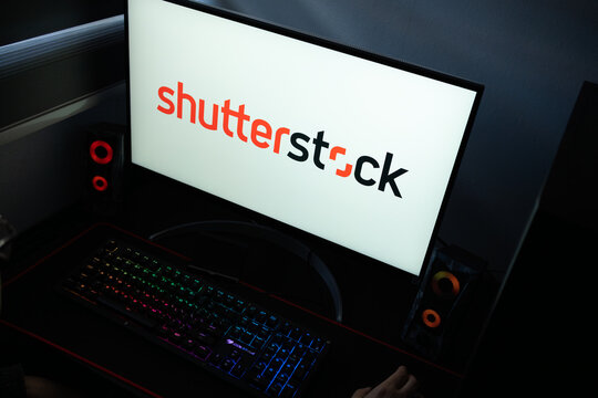Punta Arenas, Chile &ndash; January 20, 2026: A desktop monitor featuring the stylized Shutterstock logo alongside glowing computer peripherals and RGB lighting