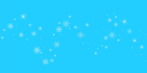 Snowfall. Falling white lacy snowflakes on a blue background. 
