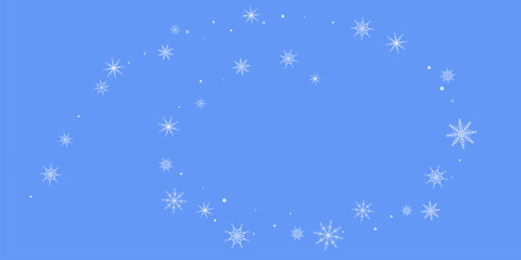 Snowfall. Falling white lacy snowflakes on a blue background. Christmas or New Year's background. 