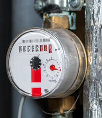 Water meters in the apartment. the concept of utility payments. Water meters connected to pipe in utility box. Concept of consumption monitoring, household infrastructure, energy efficiency, billing. 