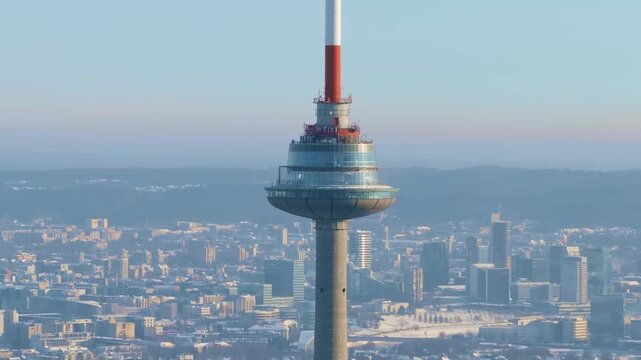 Aerial shot focusing on the Vilnius tv tower with the city skyline in the background