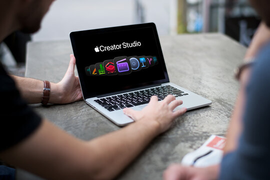 Person using macbook for apple creator studio apps