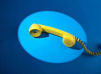 Retro vintage yellow rotary telephone