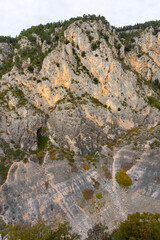 Obraz premium Steep Limestone Cliffs of Blue Lake (Modro Jezero) Karst Sinkhole, Imotski, Croatia