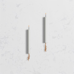 White candles with gold beads melted