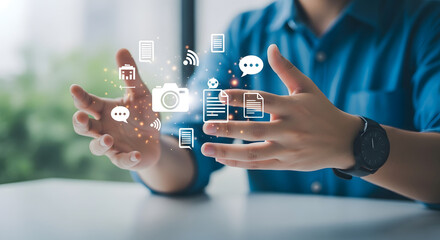 Man interacting with digital interface icons floating above his hands