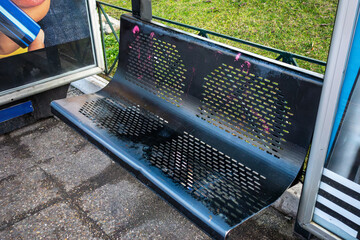 metal bench at a bus stop