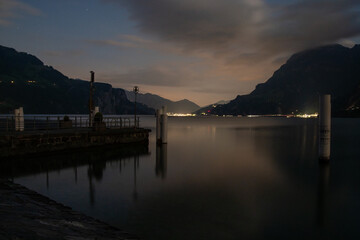 Lake Uri harbor at night reflecting Seedorf lights