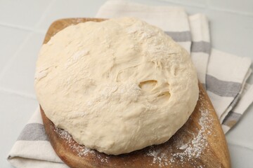 Fresh yeast dough on light table, closeup