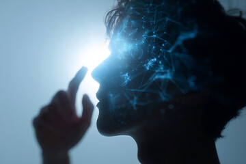 A person's face is projected onto a screen, with a finger pointing to the left