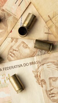 Used old ammunition casings with brazilian real bills