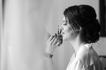 brunette bride in a tight wedding dress in a studio