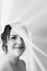 brunette bride in a tight wedding dress in a studio